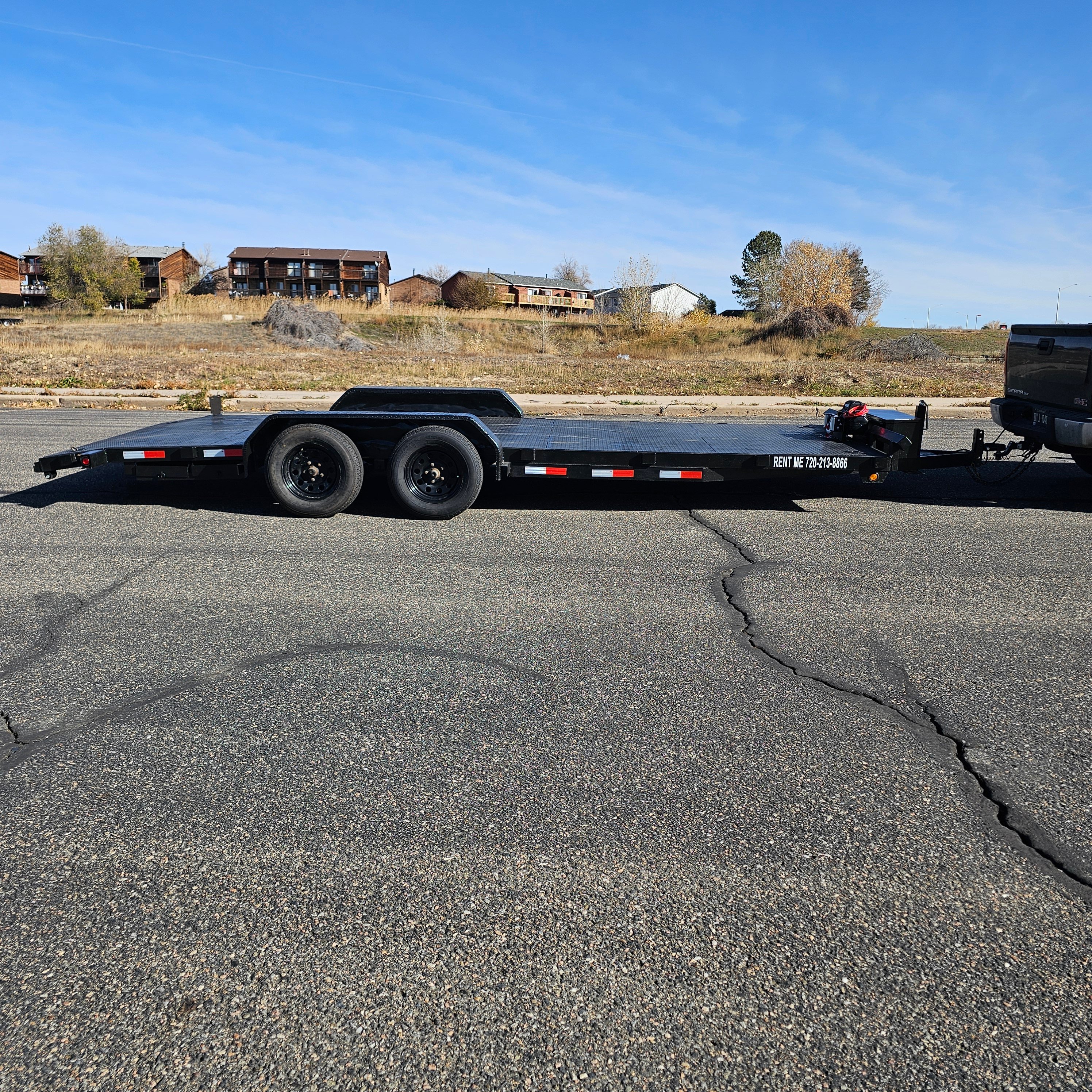 Haul Right car hauler flatbed trailer rental parked at Frederick, Colorado location ready for customer pickup